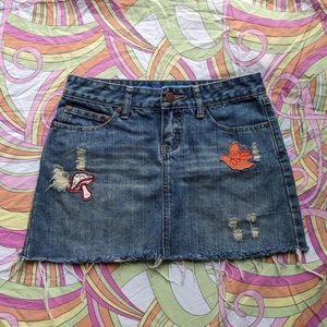 Vintage Delia’s denim mini skirt distressed with patches, size 0